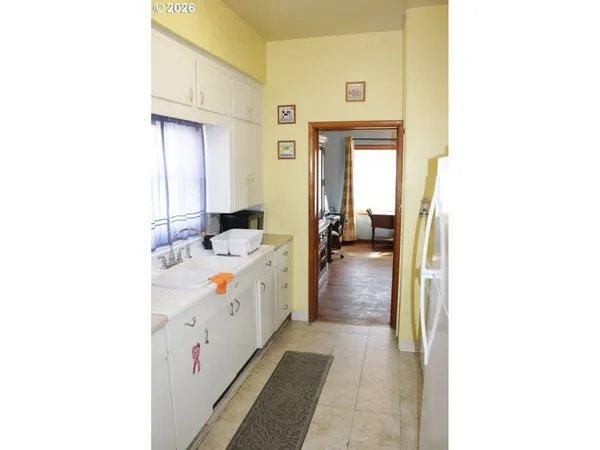 a en suite bathroom with a sink a mirror and shower