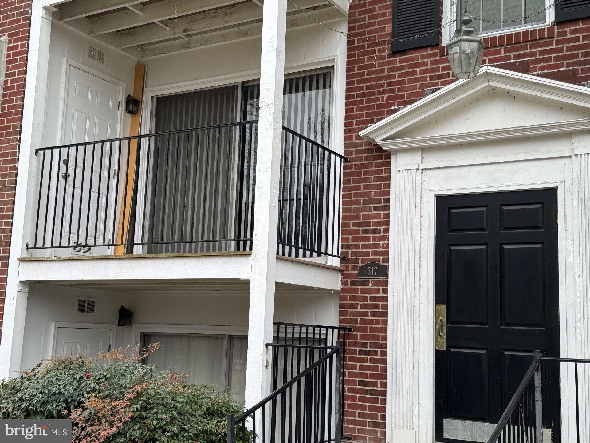 317 Homeland Southway, Unit 2A Baltimore, MD 21212 - Photo 13 of 16 a view of a house with a door and balcony