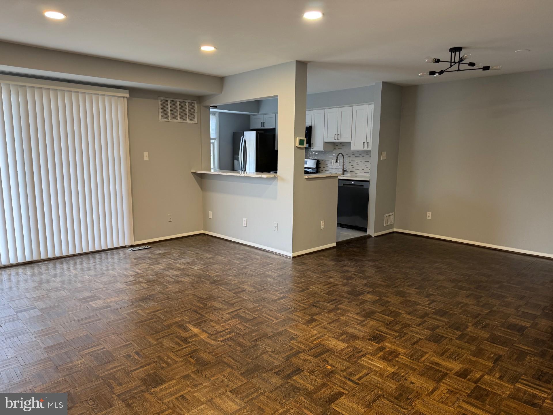 317 Homeland Southway, Unit 2A Baltimore, MD 21212 - Photo 2 of 16 a view of a kitchen with microwave and cabinets