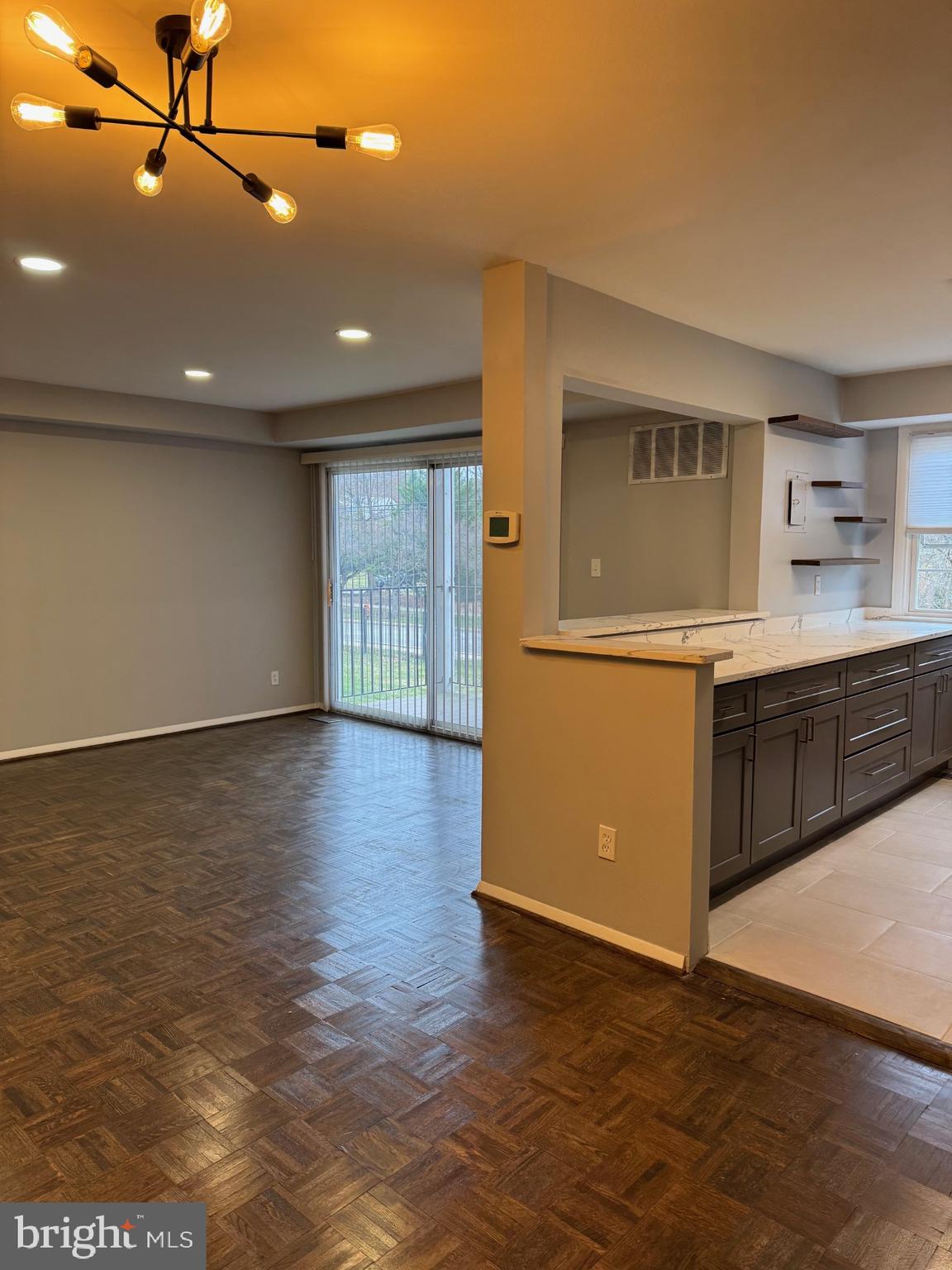 317 Homeland Southway, Unit 2A Baltimore, MD 21212 - Photo 5 of 16 a view of a kitchen with a sink and a refrigerator