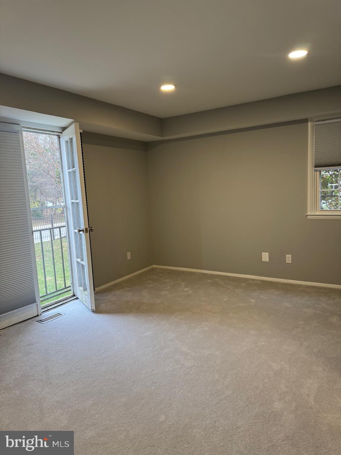 317 Homeland Southway, Unit 2A Baltimore, MD 21212 - Photo 10 of 16 an empty room with windows