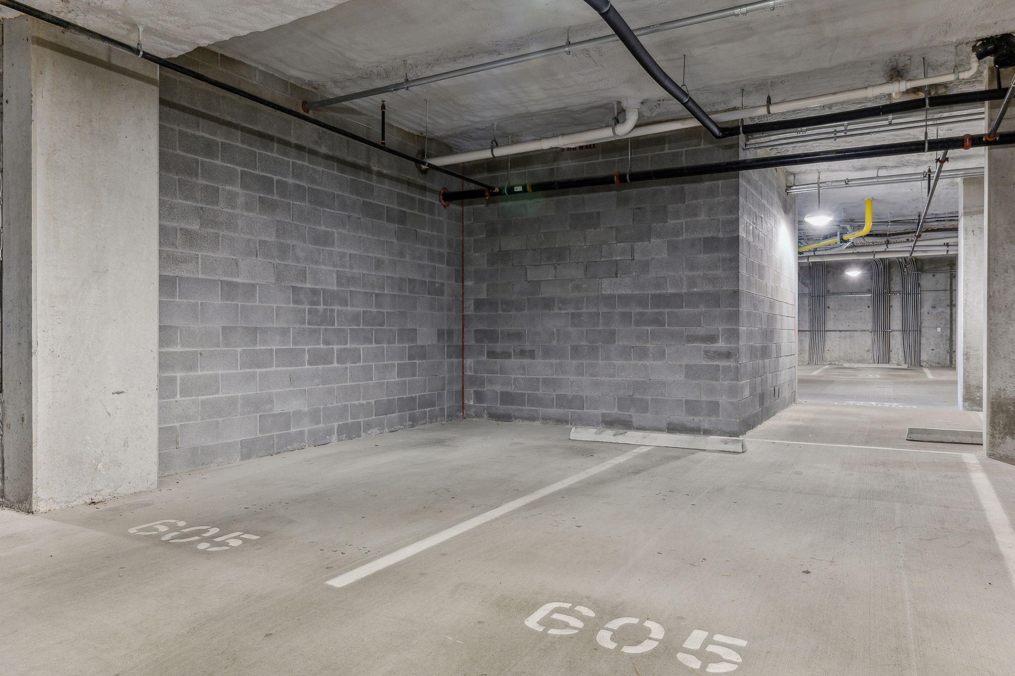 20 Rutledge Street, Unit 605 Nashville, TN 37210 - Photo 30 of 63 Two side-by-side parking spots that are deeded and designated are found on the main floor parking with the entrance on the Rutledge side. It's the same floor as mailboxes and the concierge/front desk.