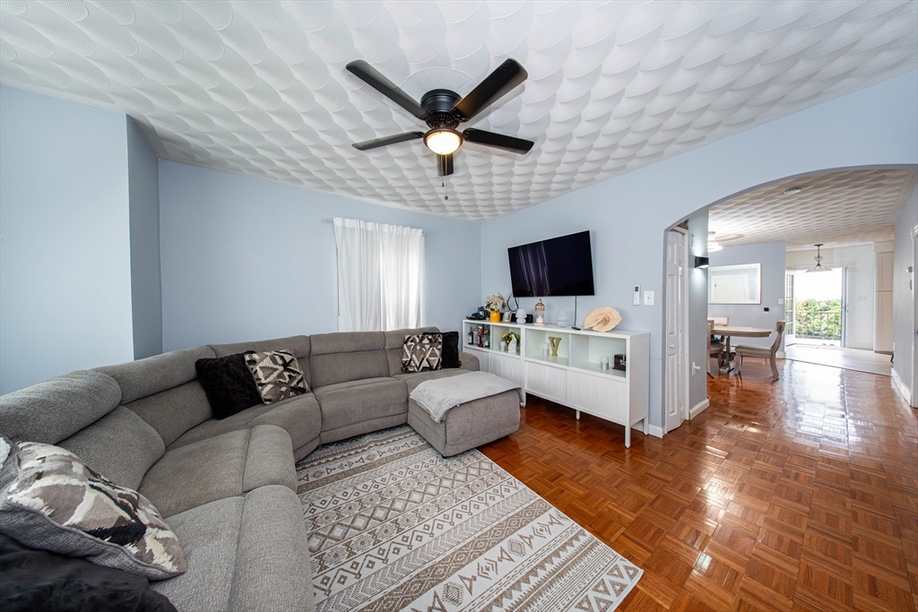 166 Bradford Avenue Fall River, MA 02721 - Photo 11 of 42 a living room with furniture and a flat screen tv