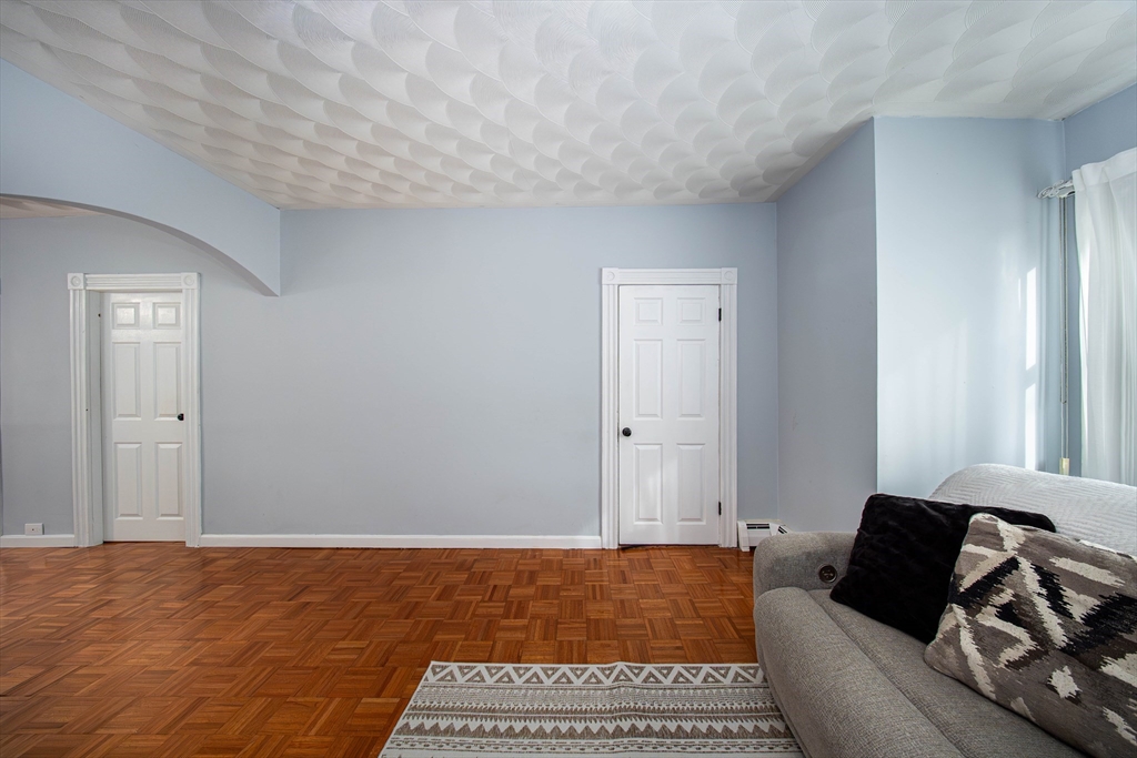 166 Bradford Avenue Fall River, MA 02721 - Photo 12 of 42 a living room with furniture and a rug