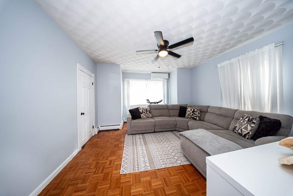 166 Bradford Avenue Fall River, MA 02721 - Photo 13 of 42 a living room with furniture and a large window