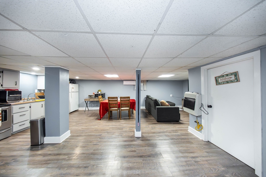 166 Bradford Avenue Fall River, MA 02721 - Photo 16 of 42 a living room with furniture and a wooden floor