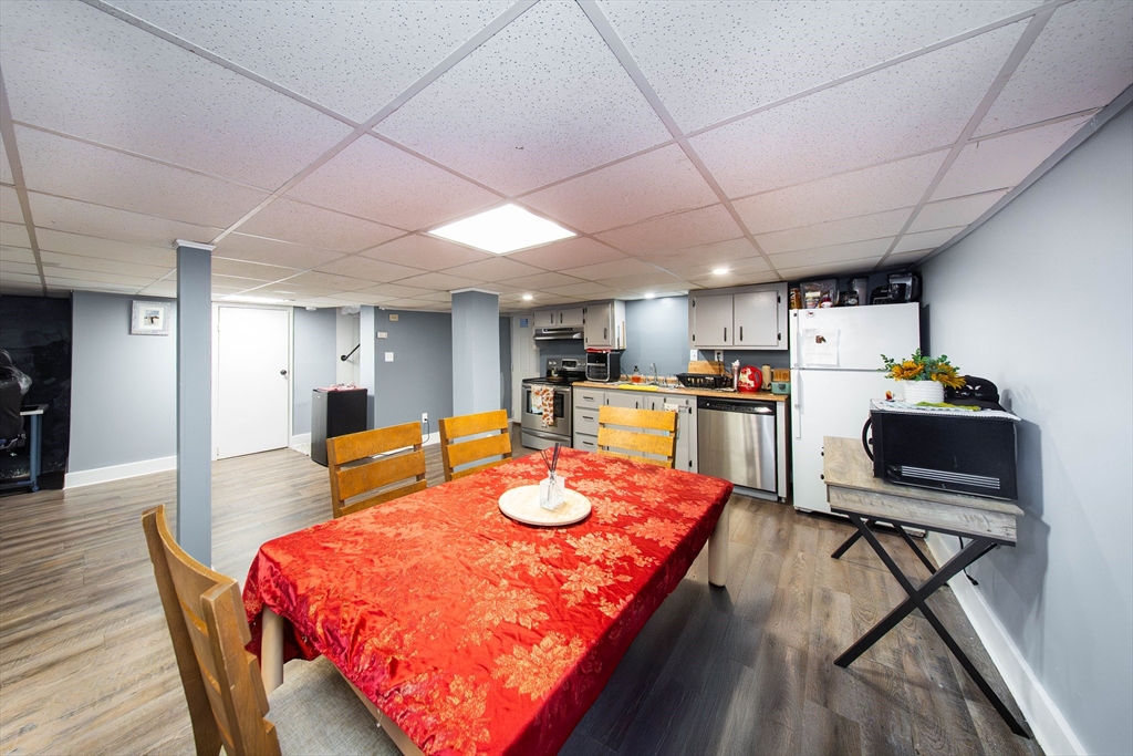 166 Bradford Avenue Fall River, MA 02721 - Photo 18 of 42 a dining room with furniture and wooden floor