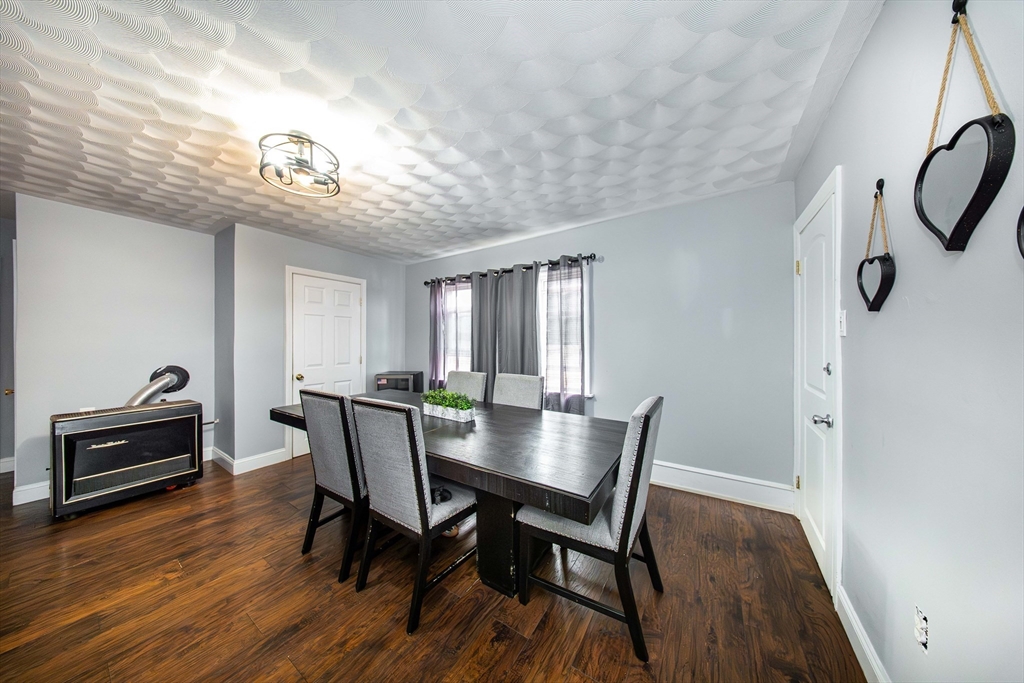 166 Bradford Avenue Fall River, MA 02721 - Photo 27 of 42 a view of a dining room with furniture window and wooden floor