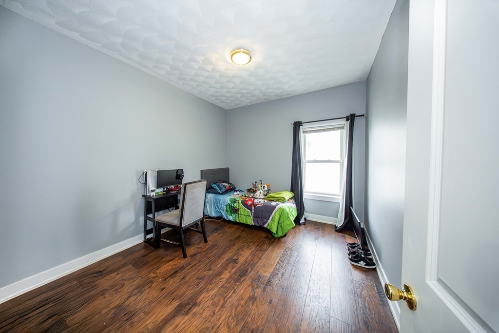 166 Bradford Avenue Fall River, MA 02721 - Photo 31 of 42 a workspace with furniture and wooden floor