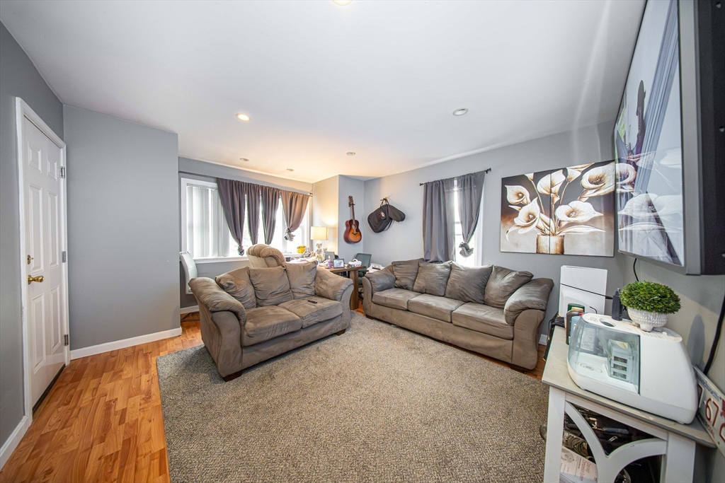 166 Bradford Avenue Fall River, MA 02721 - Photo 35 of 42 a living room with furniture and a window