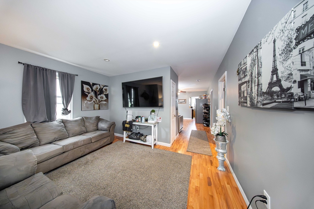 166 Bradford Avenue Fall River, MA 02721 - Photo 36 of 42 a living room with furniture and a flat screen tv