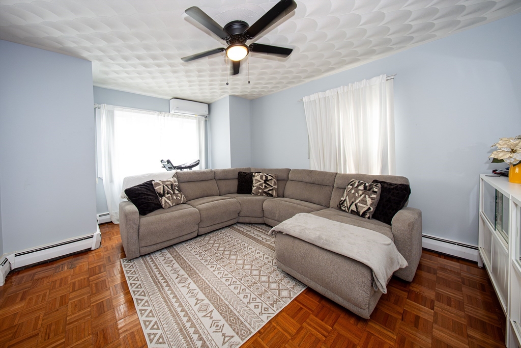 166 Bradford Avenue Fall River, MA 02721 - Photo 10 of 42 a living room with a couch and a window