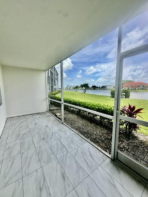 1047 Exeter C Boca Raton, FL 33434 - Photo 12 of 37 a view of a room with wooden floor