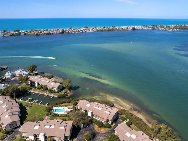an aerial view of a house with a lake view