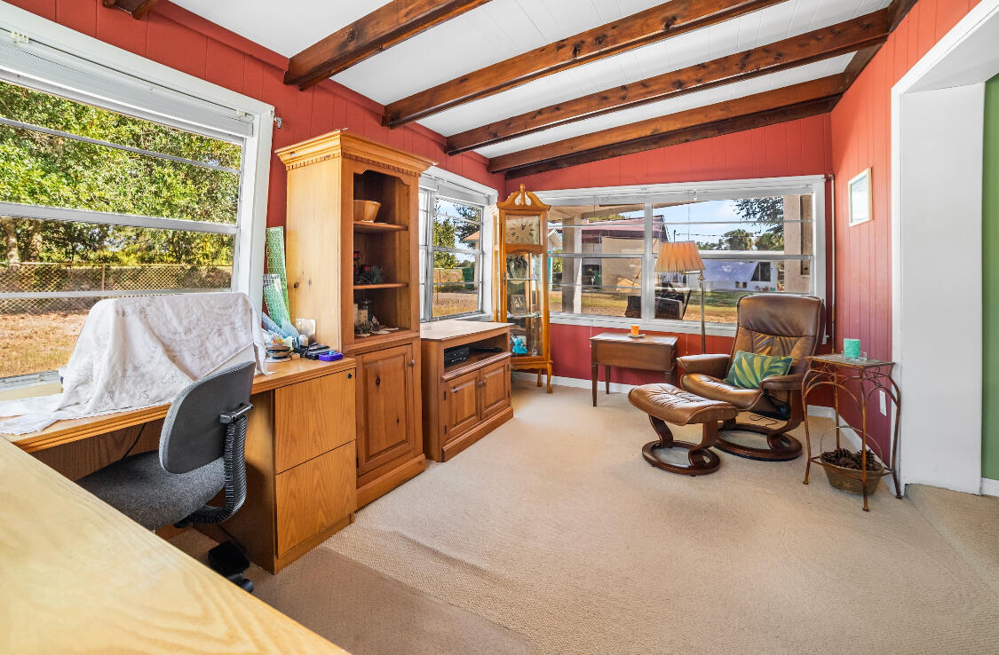 3966 Northwest 20th Avenue Okeechobee, FL 34972 - Photo 17 of 35 a living room filled with furniture and a large window