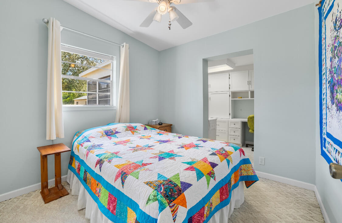 3966 Northwest 20th Avenue Okeechobee, FL 34972 - Photo 18 of 35 a bedroom with a bed and a window