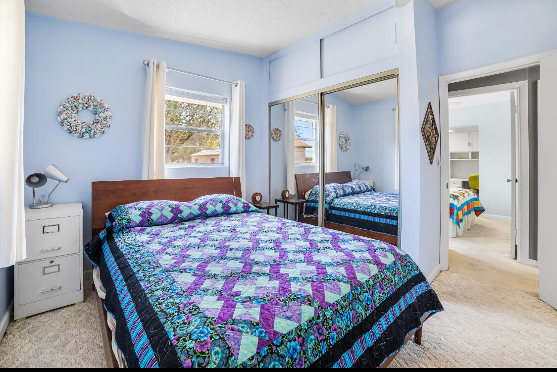 3966 Northwest 20th Avenue Okeechobee, FL 34972 - Photo 22 of 35 a bedroom with a bed and walk in closet