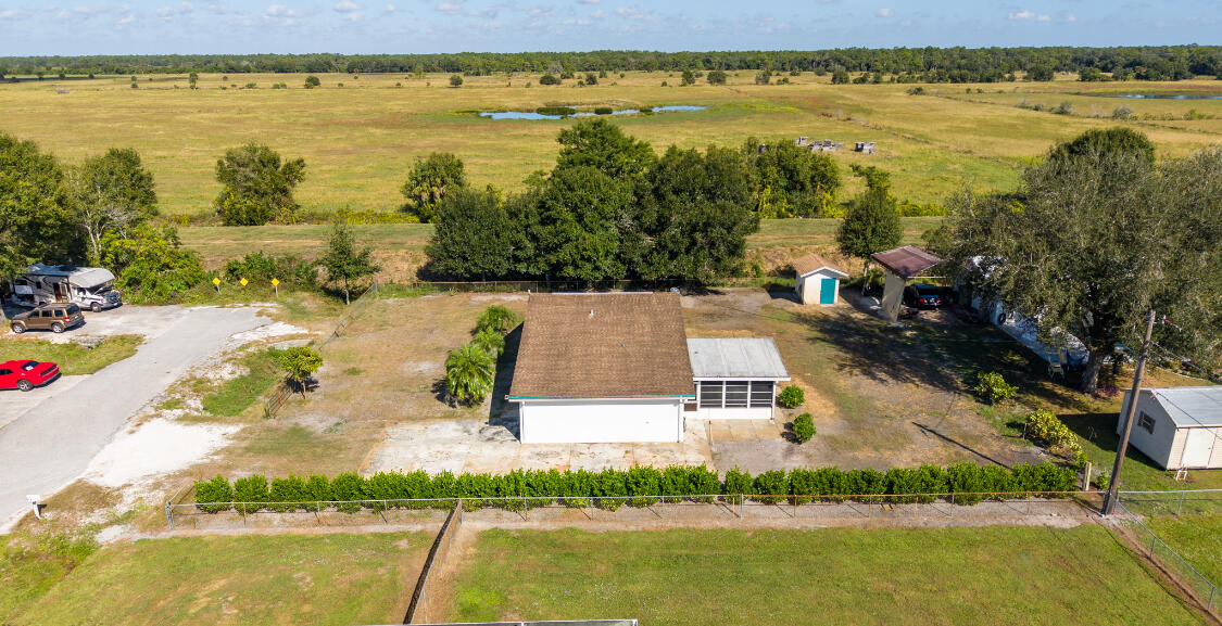 3966 Northwest 20th Avenue Okeechobee, FL 34972 - Photo 23 of 35 a view of an ocean with a house in the background