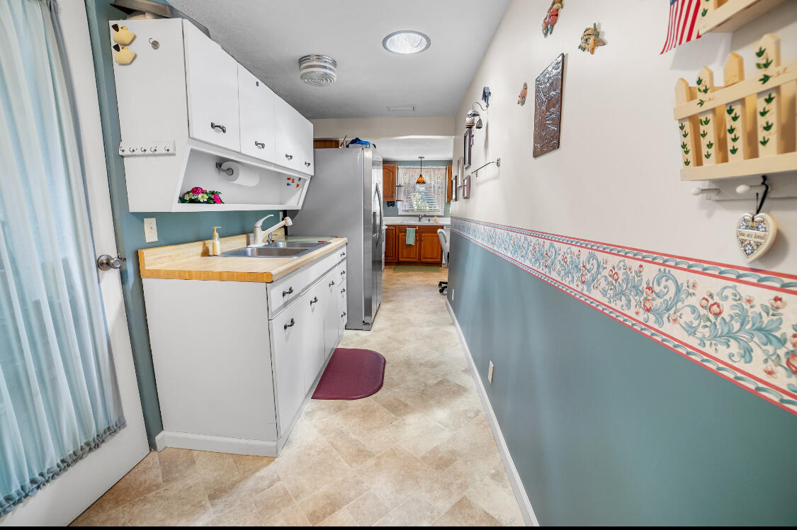3966 Northwest 20th Avenue Okeechobee, FL 34972 - Photo 26 of 35 a kitchen with stainless steel appliances a refrigerator and a stove