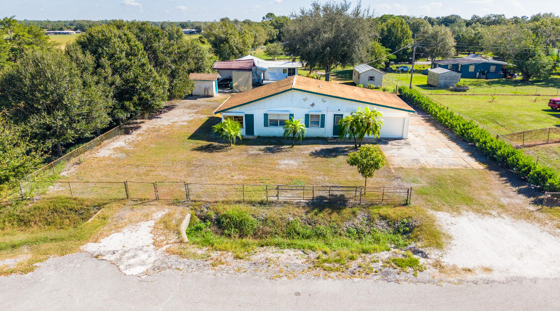 3966 Northwest 20th Avenue Okeechobee, FL 34972 - Photo 33 of 35 a view of a house with a yard