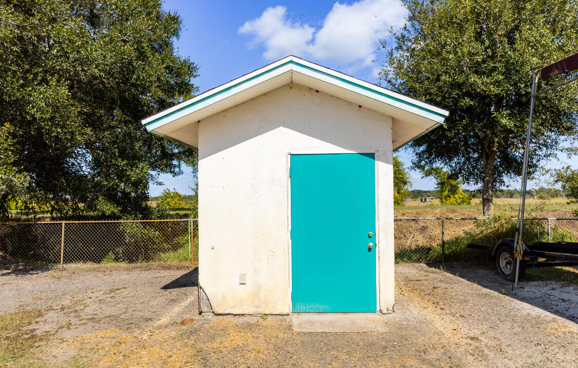 3966 Northwest 20th Avenue Okeechobee, FL 34972 - Photo 35 of 35 a view of a backyard of a house