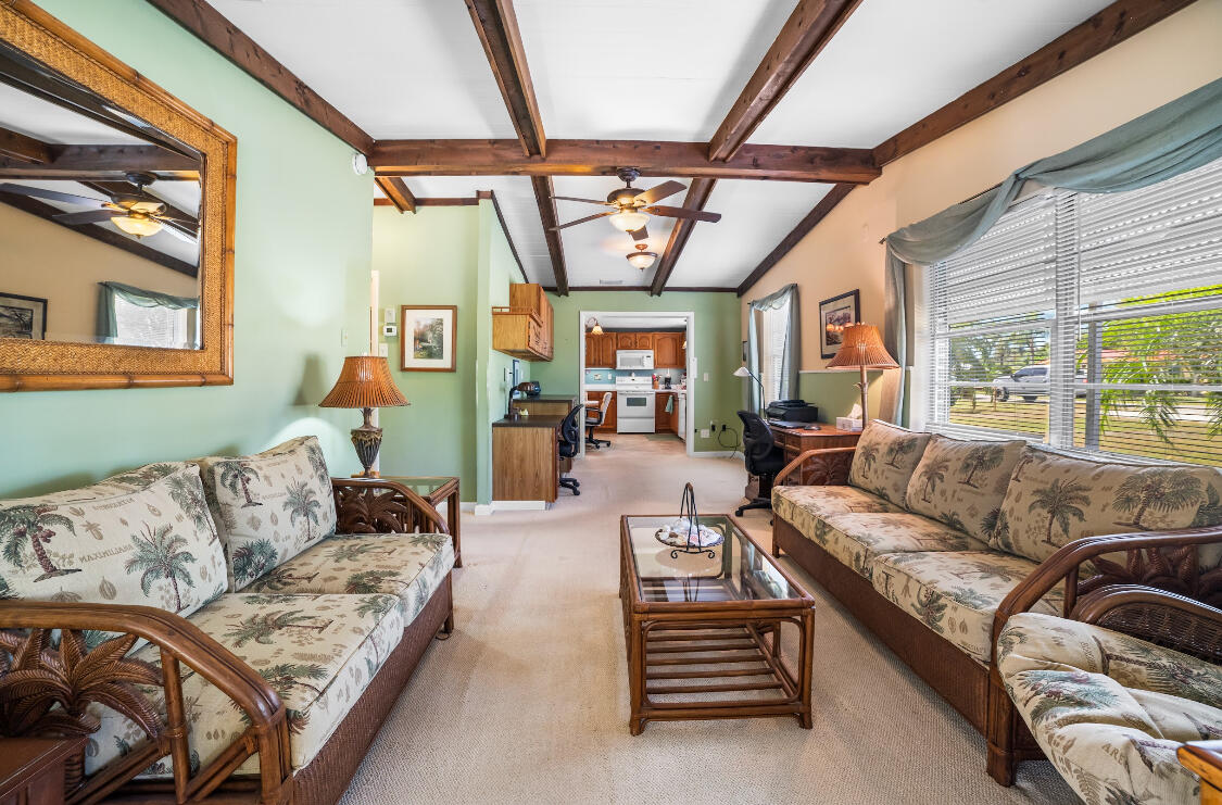 3966 Northwest 20th Avenue Okeechobee, FL 34972 - Photo 4 of 35 a living room with furniture and a large window
