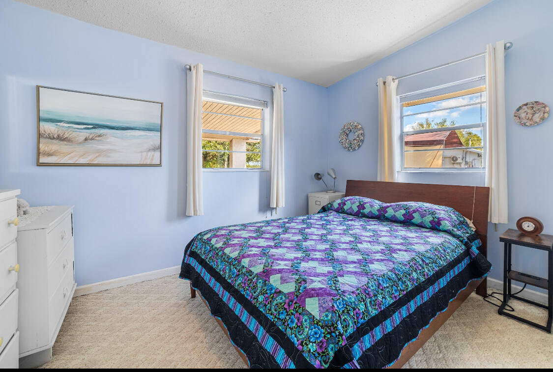 3966 Northwest 20th Avenue Okeechobee, FL 34972 - Photo 5 of 35 a bedroom with a bed and window