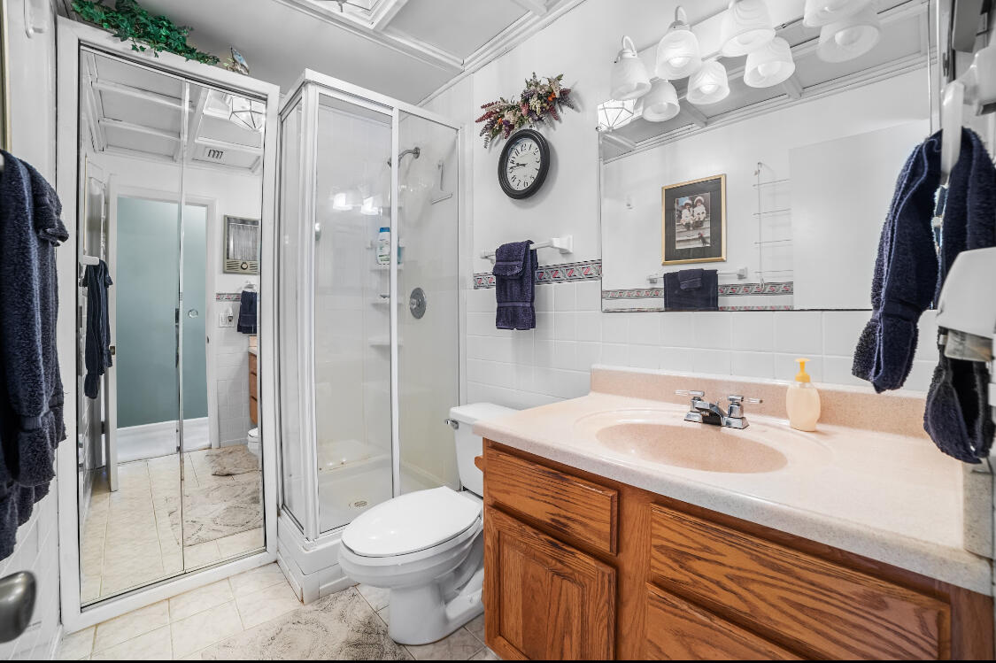 3966 Northwest 20th Avenue Okeechobee, FL 34972 - Photo 6 of 35 a bathroom with a sink a toilet and shower