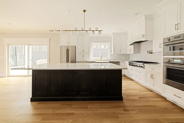 a kitchen with a cabinets and appliances