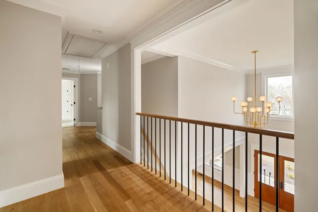 a view of hallway with wooden floor