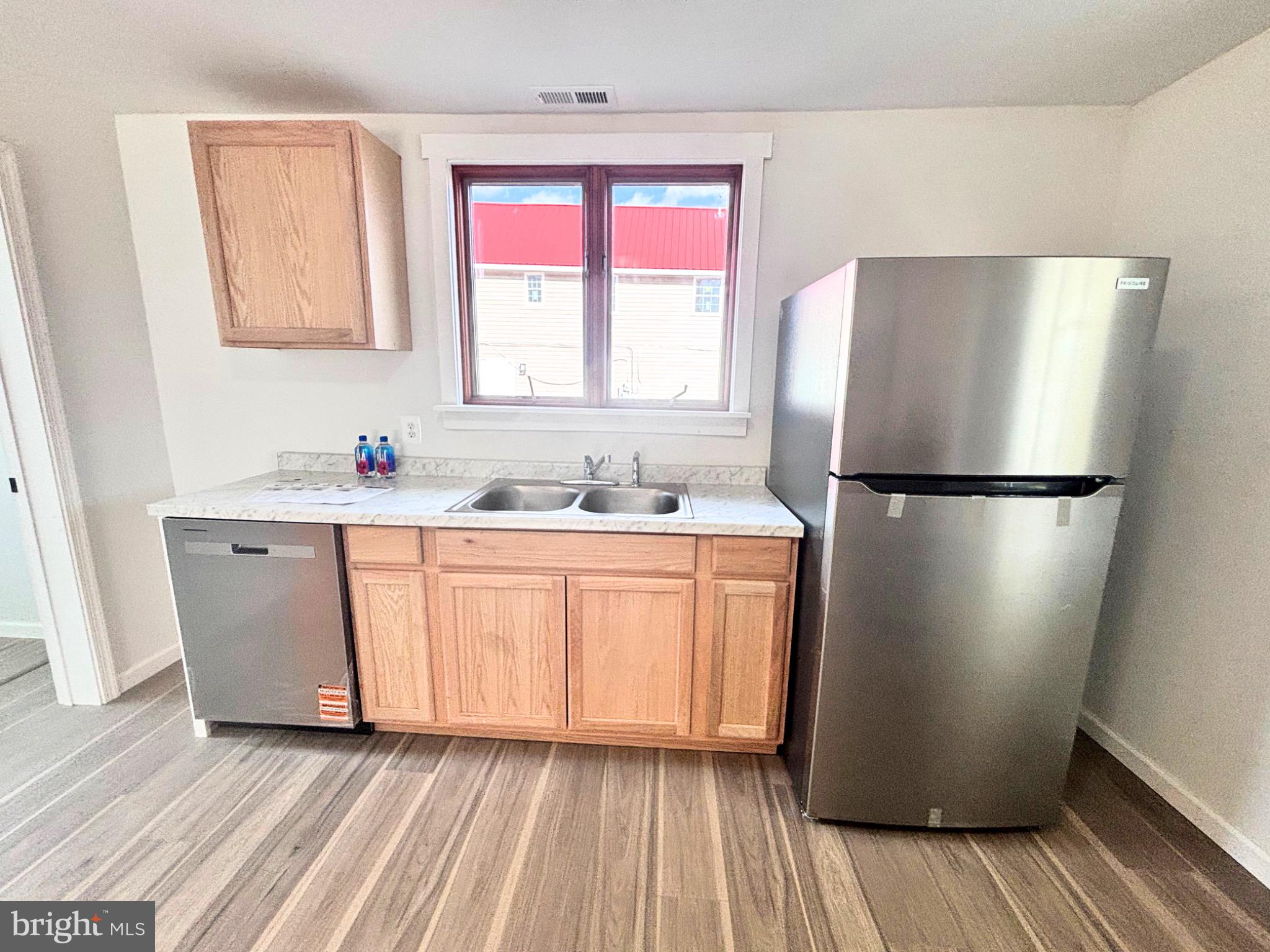 206 Academy Street Greensboro, MD 21639 - Photo 8 of 40 Modern kitchen with sleek appliances.
