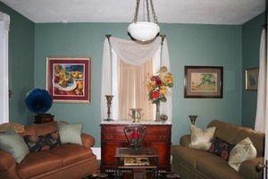 401 South Malta Road Malta, IL 60150 - Photo 5 of 25 a living room with furniture and a chandelier
