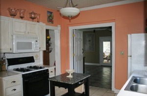401 South Malta Road Malta, IL 60150 - Photo 9 of 25 a kitchen with stainless steel appliances granite countertop a stove and a refrigerator