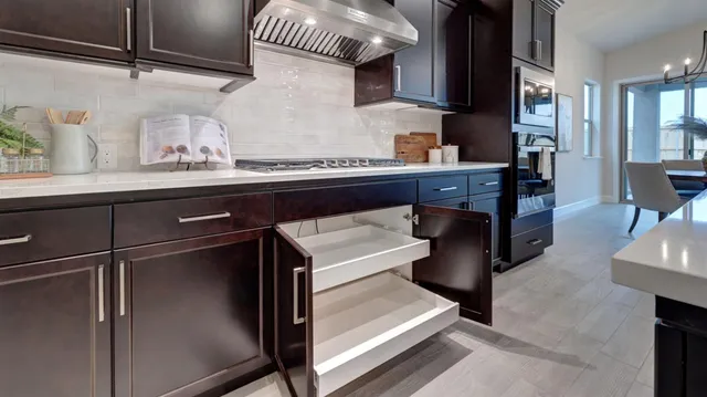 a kitchen with a refrigerator and a sink