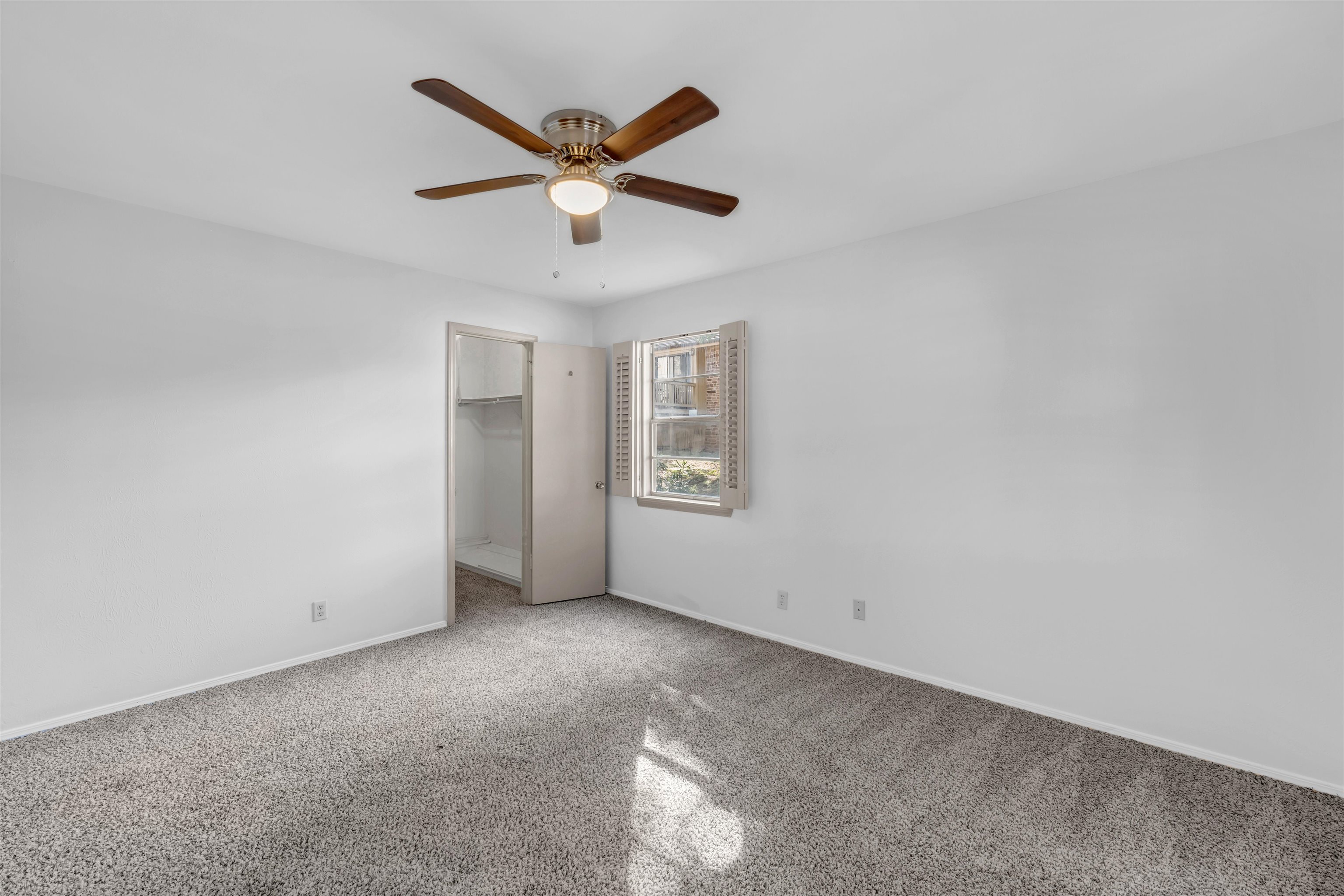 1206 Hi Stirrup Horseshoe Bay, TX 78657 - Photo 16 of 25 an empty room with windows and fan