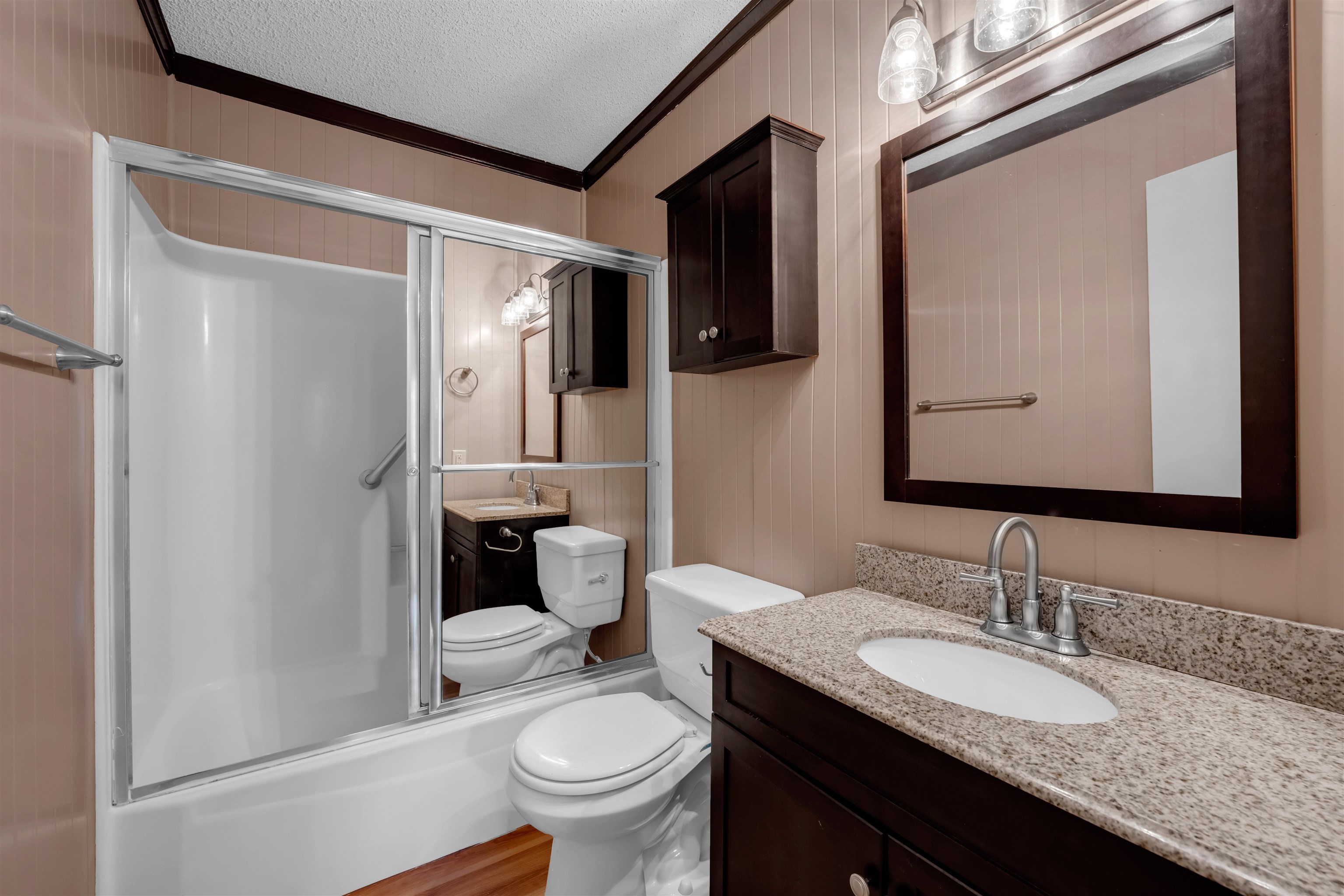1206 Hi Stirrup Horseshoe Bay, TX 78657 - Photo 20 of 25 a bathroom with a granite countertop sink toilet and shower