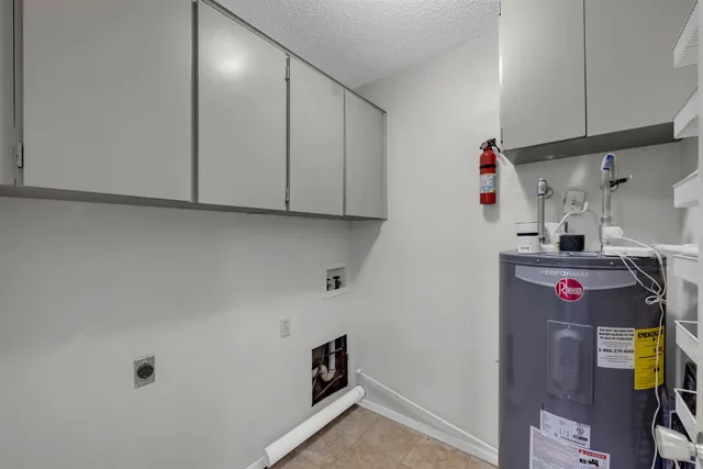 a view of a house with backyard and porch