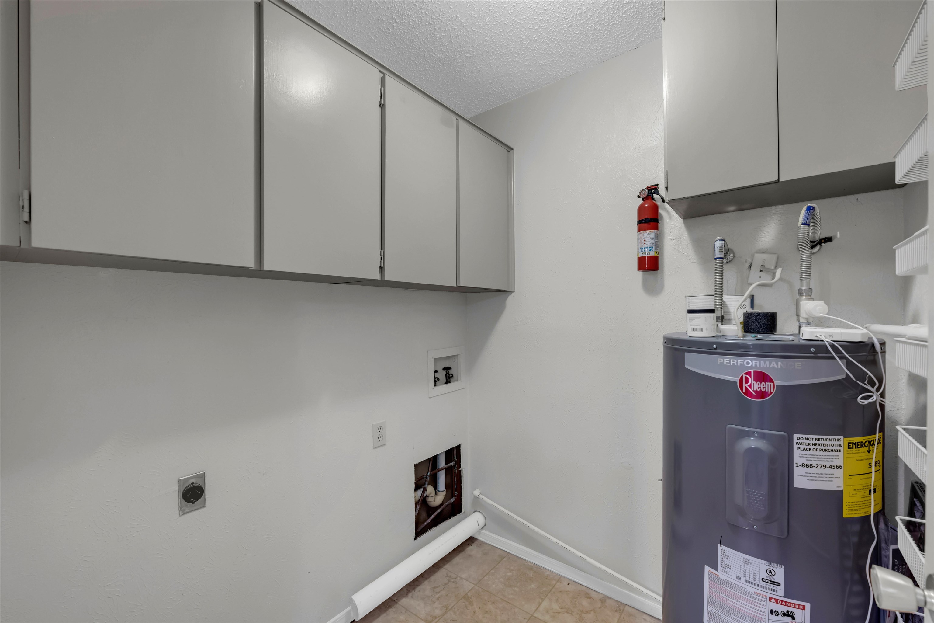 1206 Hi Stirrup Horseshoe Bay, TX 78657 - Photo 21 of 25 a view of storage and utility room with a small washer and dryer