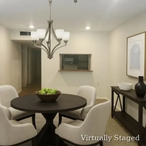 a view of a dining room with furniture