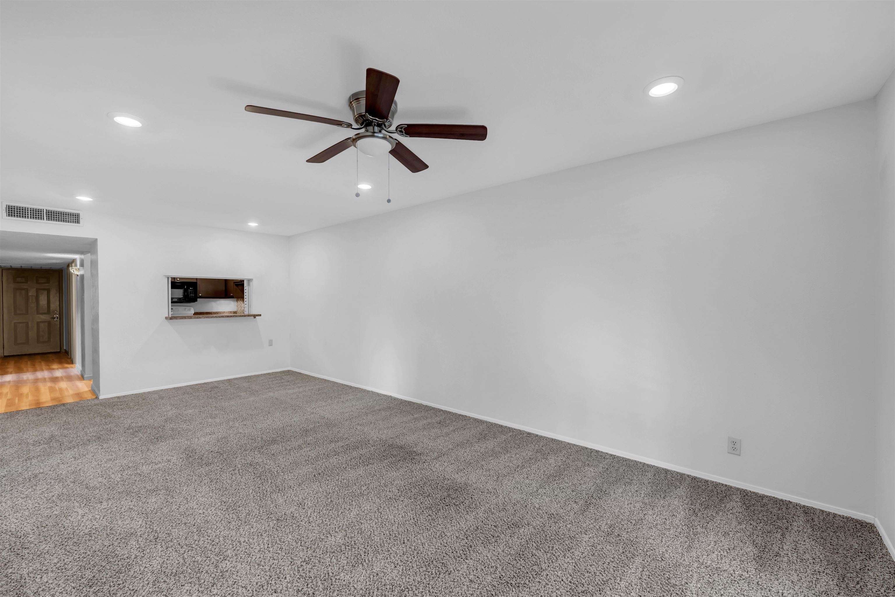 1206 Hi Stirrup Horseshoe Bay, TX 78657 - Photo 8 of 25 an empty room with a kitchen space and stainless steel appliances