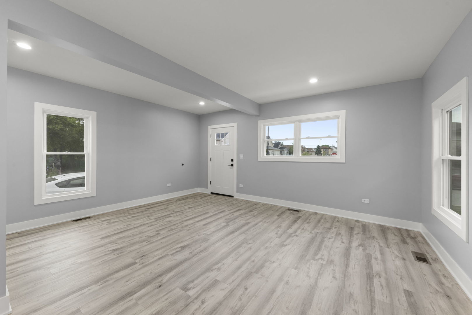 7600 West 60th Street Summit, IL 60501 - Photo 5 of 22 a view of an empty room with wooden floor and a window