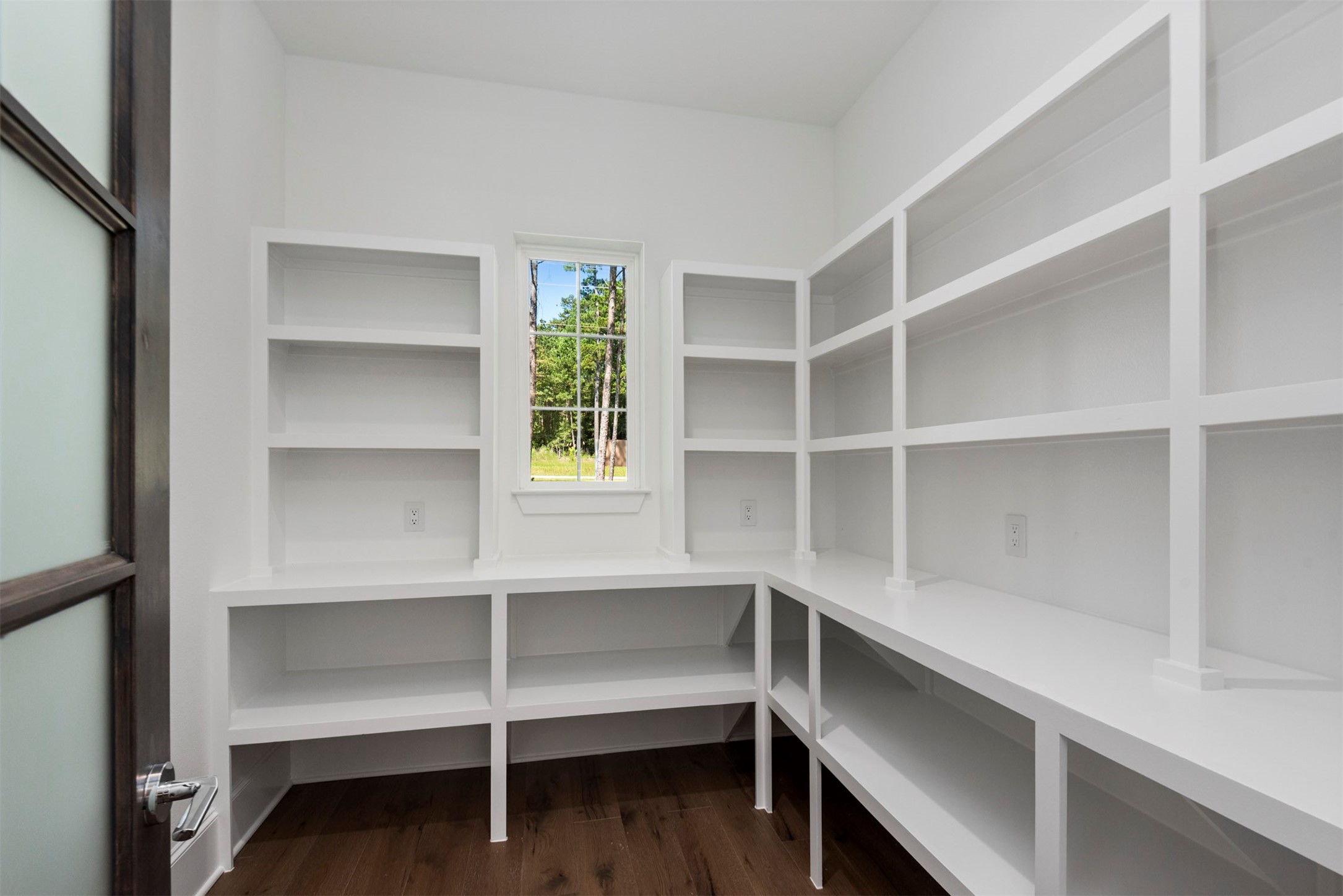 630 Lonestar Road Huntsville, TX 77340 - Photo 21 of 48 Incredible walk-in pantry has custom shelves with a spot for everything including your stand mixer and small appliances.