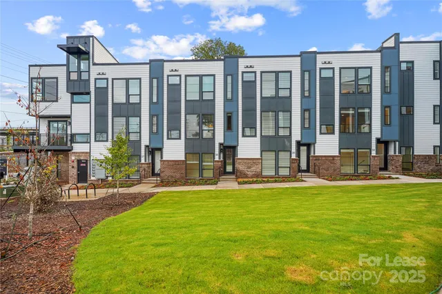 a swimming pool with outdoor seating and yard