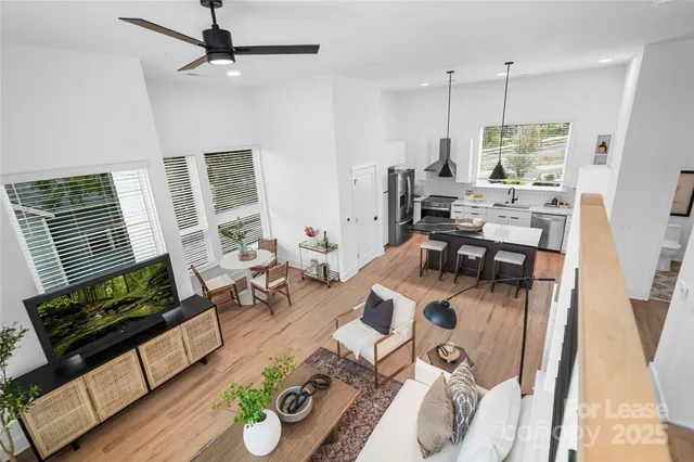 a bed room with a bed and a painting on the wall