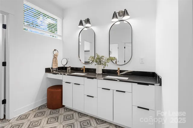 a living room with furniture and a lamp