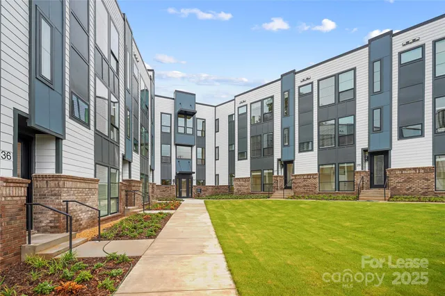 a view of a building with a yard