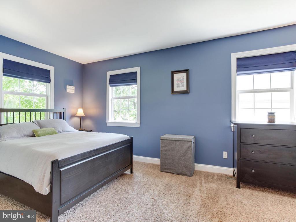 132 Oakwood Road Edgewater, MD 21037 - Photo 15 of 37 a bedroom with a bed and a window