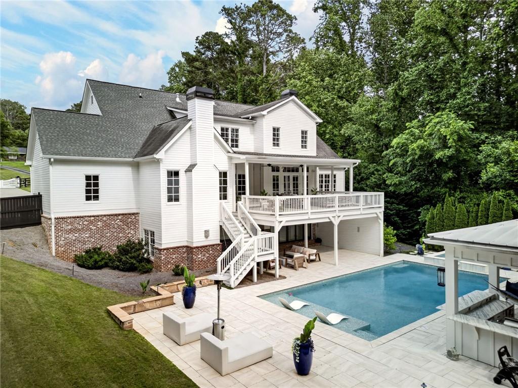 13460 New Providence Road Milton, GA 30004 - Photo 57 of 60 a front view of a house with garden