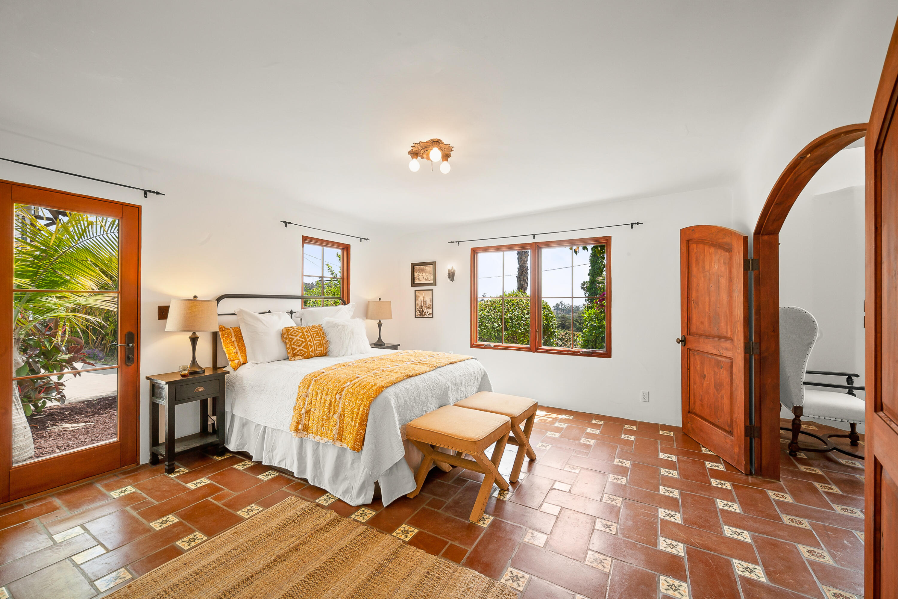 870 Windsor Way Santa Barbara, CA 93105 - Photo 11 of 59 a bed room with a bed and a large window