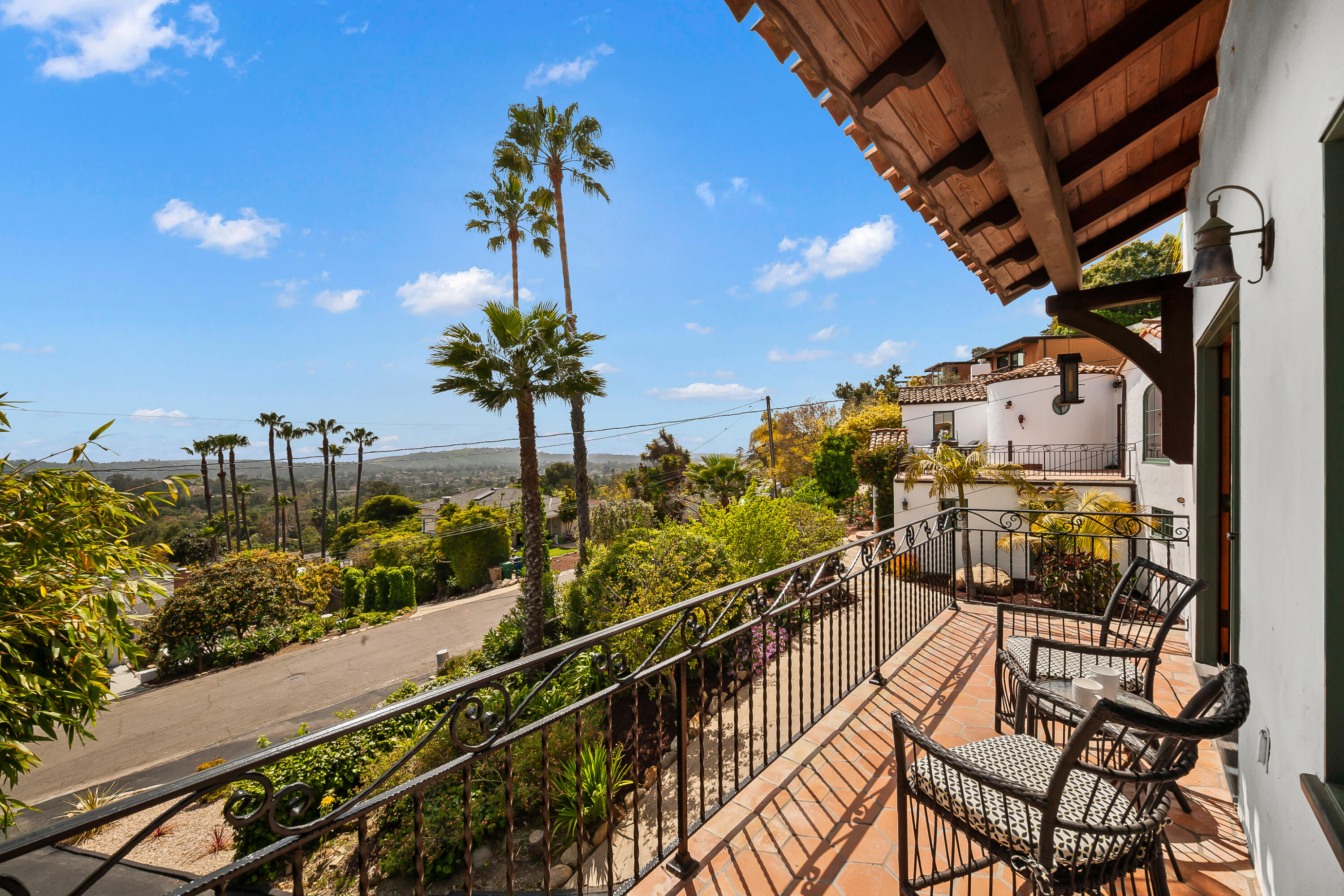 870 Windsor Way Santa Barbara, CA 93105 - Photo 19 of 59 a view of a balcony with chairs potted plants